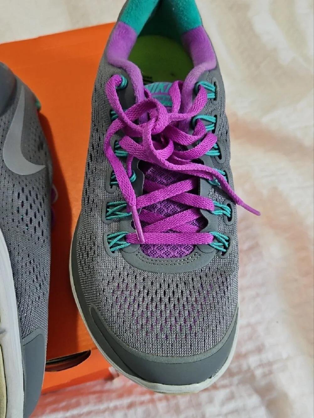 Nike Women’s Gray Athletic Shoes with Purple and Teal Accents